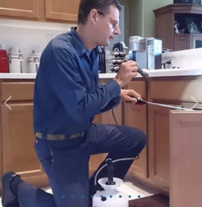 Gene of Green Land Pest Control providing residential pest control service in a Pasco County Florida home